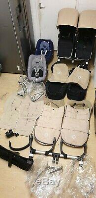 Bugaboo donkey twin sets in sand with car seats, footmuffs etc
